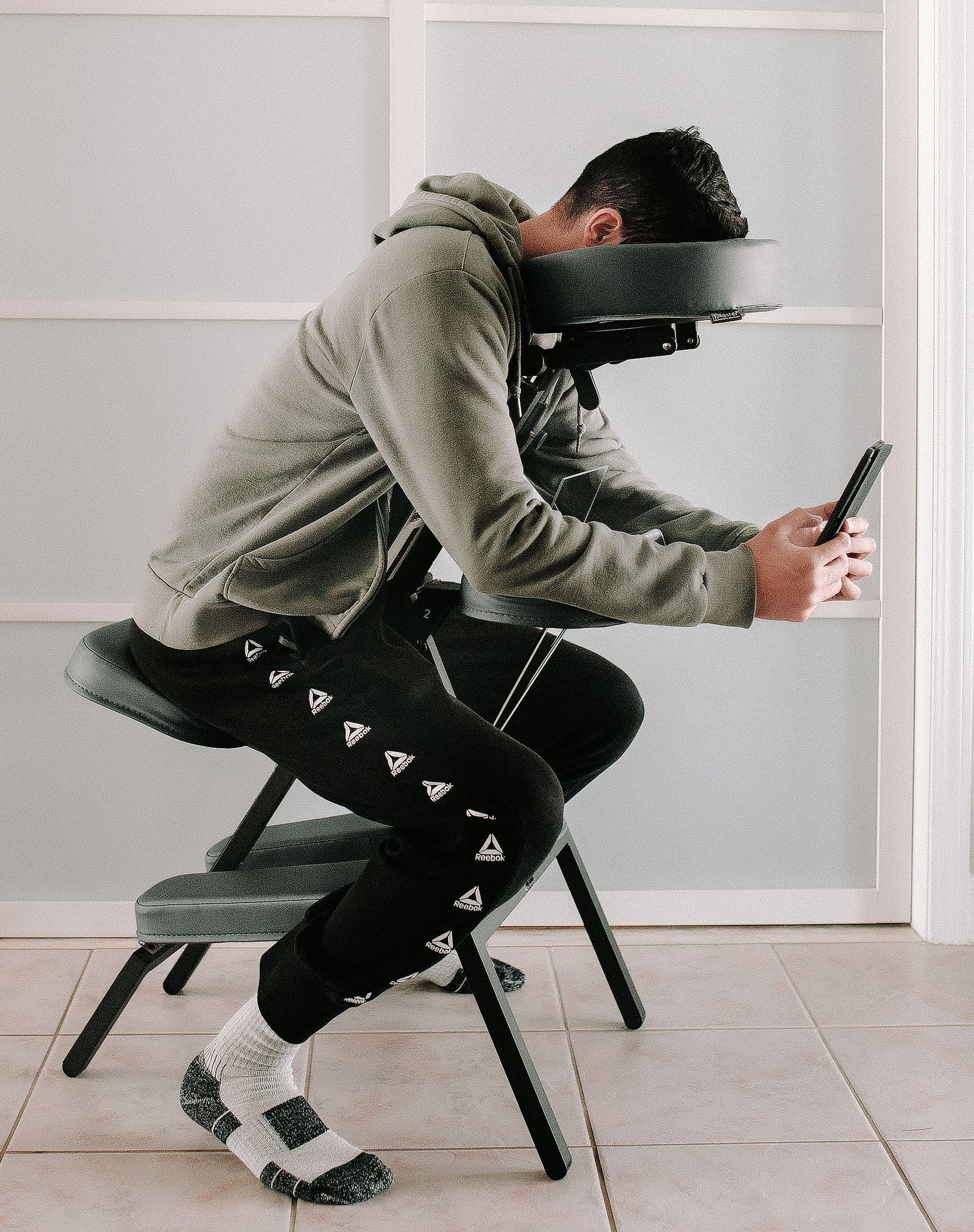 Patient using a seated face down chair rental for retina surgery recovery