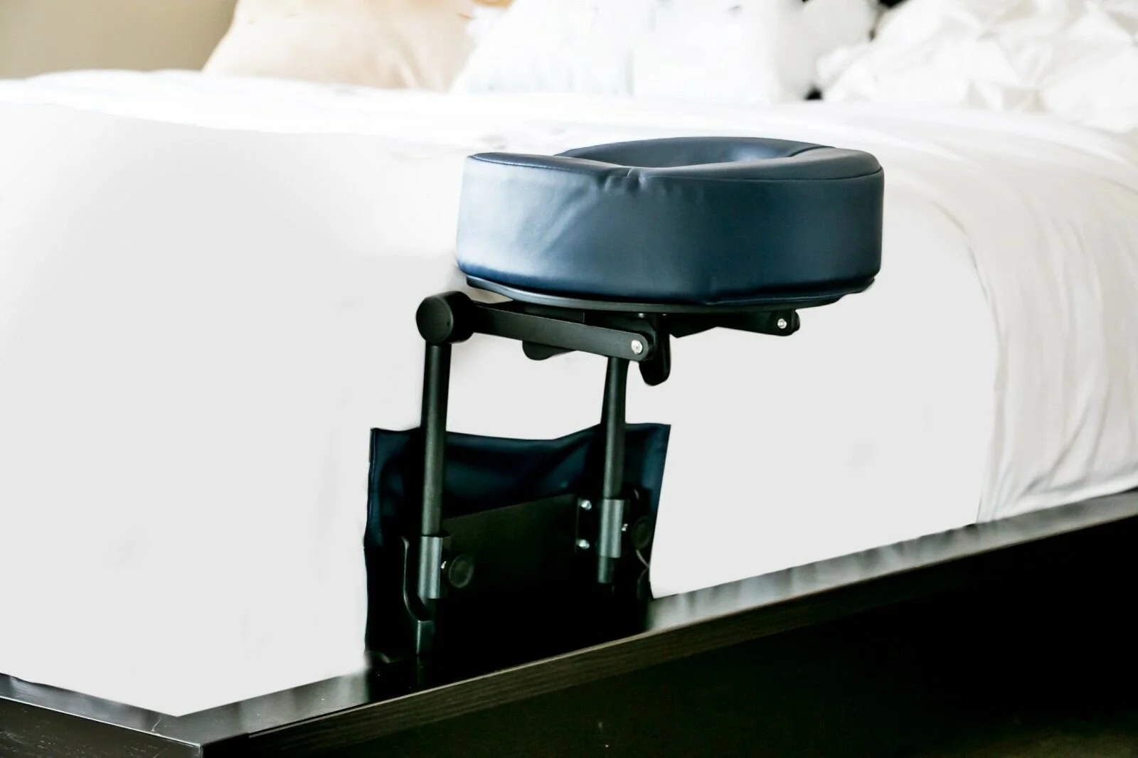 Face down headrest attached to the side of a bed