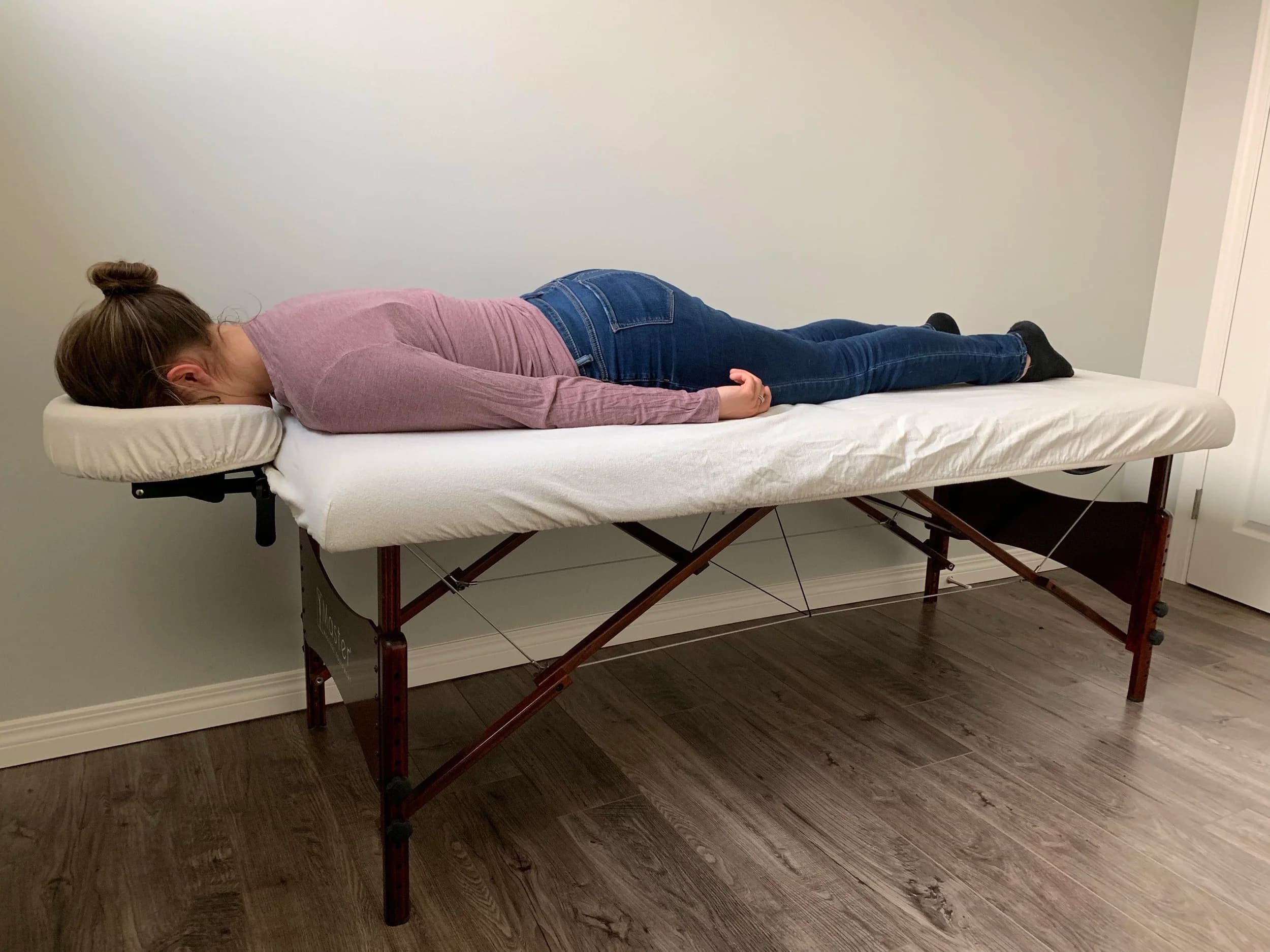 Patient resting on a face down bed at home