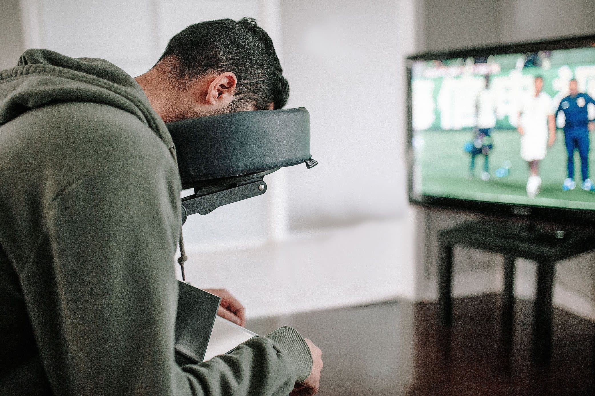 Patient using a face down mirror to watch television