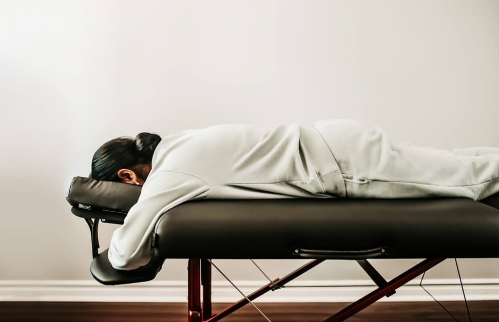 Patient sleeping face down on a recovery bed