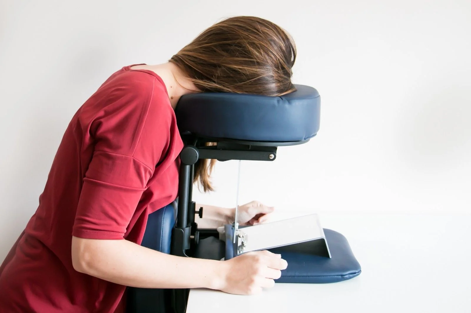 Patient reading with portable seated face down support